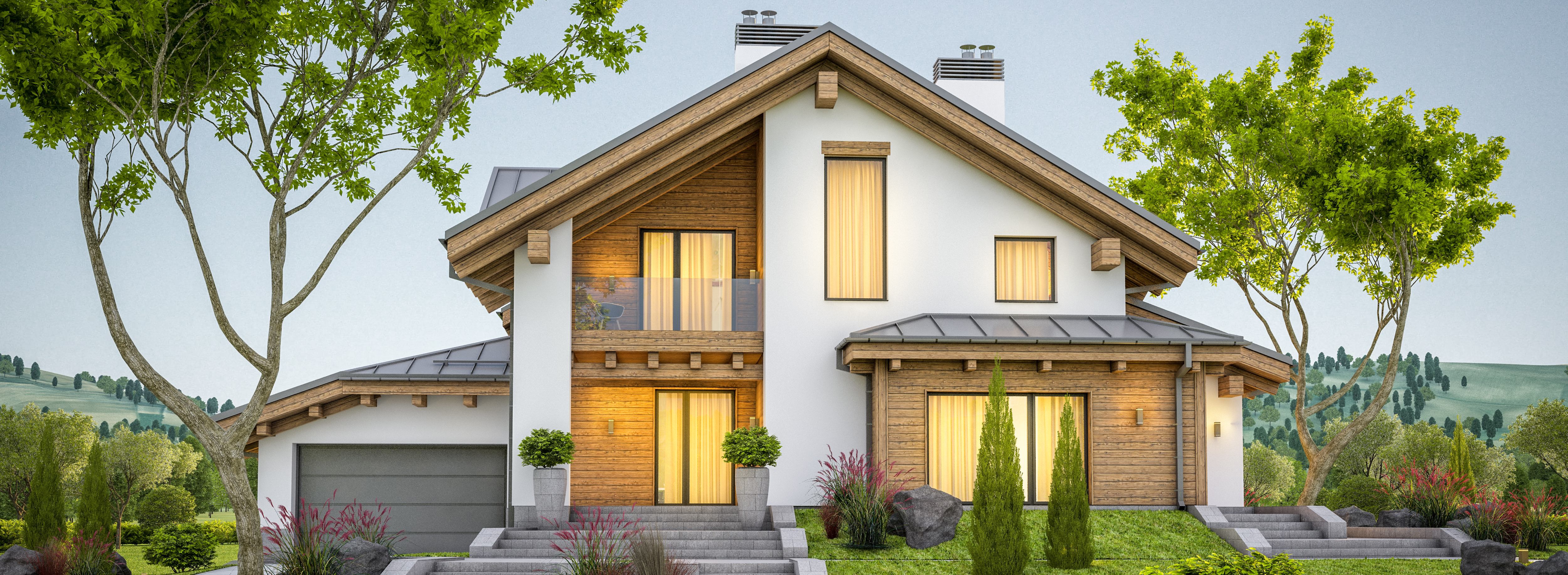 White house with well-kept lawn with hills in background