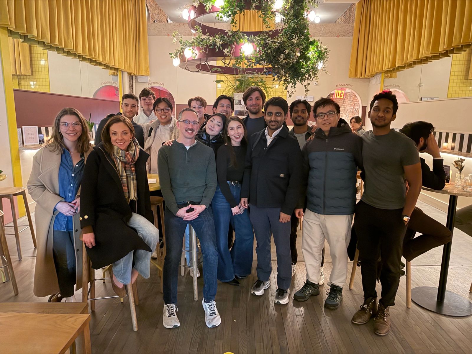 The Nuvo team gathered around a long table at a company dinner