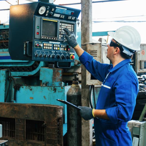 A machine operator working in a factory