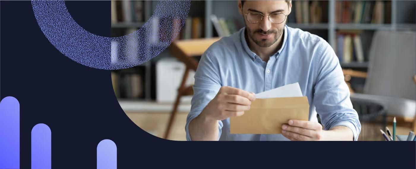 A man reading a payment reminder letter received before past due notices
