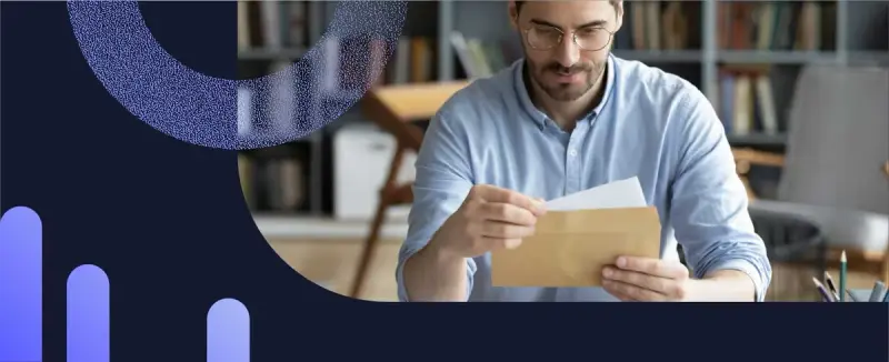A man reading a payment reminder letter received before past due notices