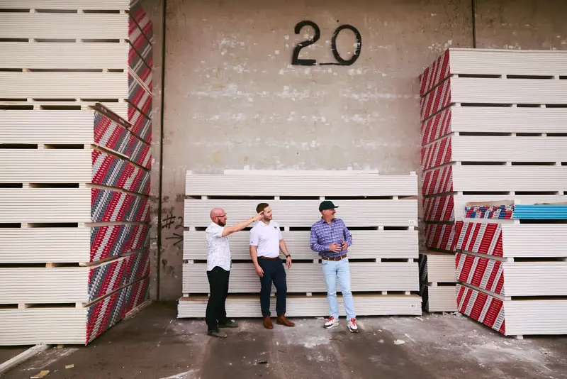 Three Kodiak Building Partners / Jones Heartz teammates, featured photo between the Challenge and Solution sections