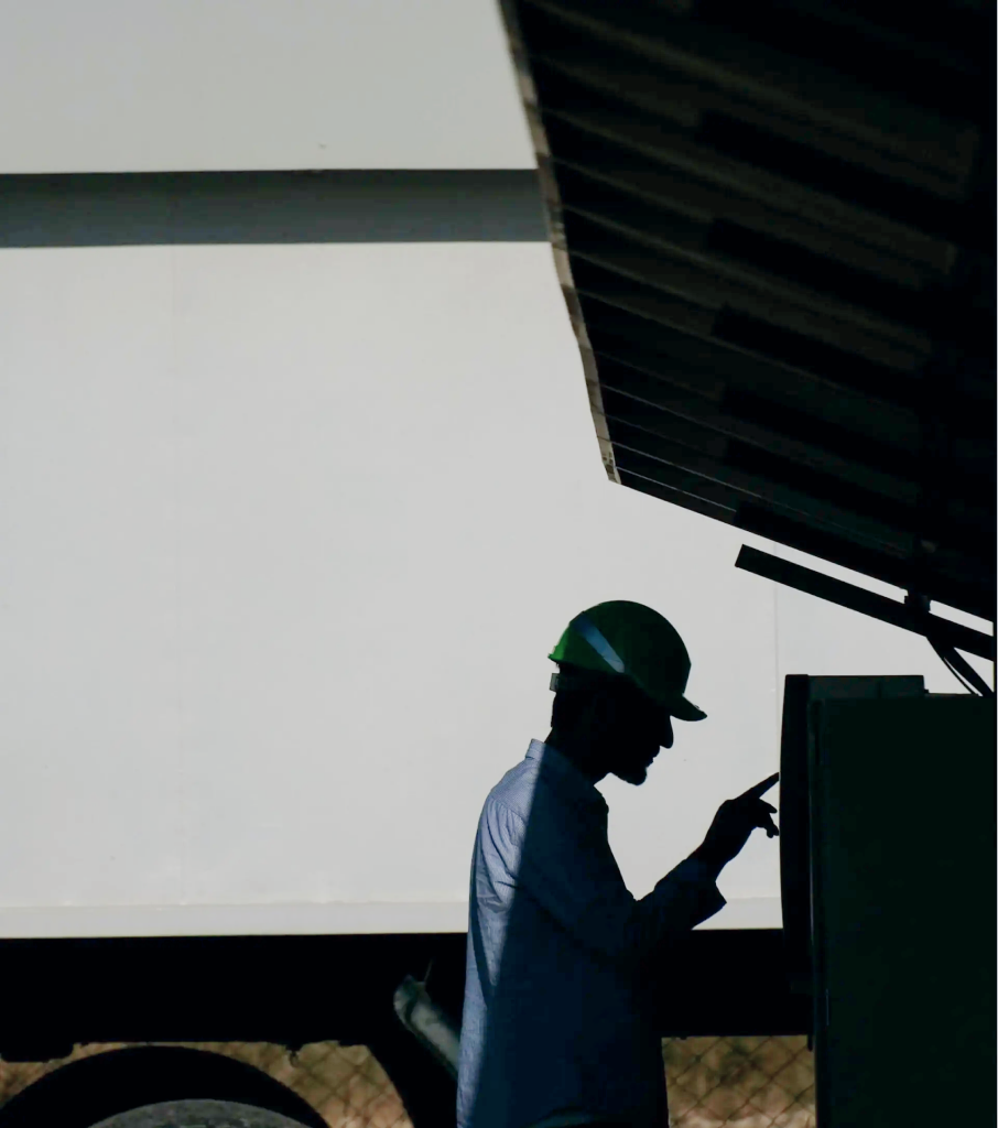 A worker at a warehouse shelf