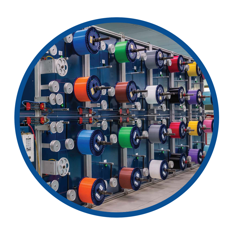 Optical fibre colouring equipment inside the cable production facility