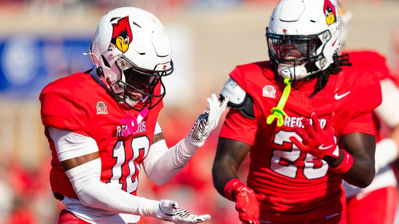 Illinois State's Key Crowell (10) celebrates with a teammate during the Redbirds' 17-10 homecoming win over Indiana State on Oct. 24, 2026, at Hancock Stadium in Normal, Illinois.