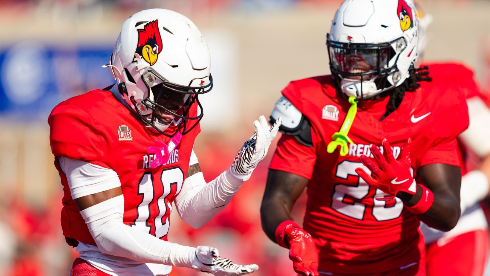 Illinois State's Key Crowell (10) celebrates with a teammate during the Redbirds' 17-10 homecoming win over Indiana State on Oct. 24, 2026, at Hancock Stadium in Normal, Illinois.