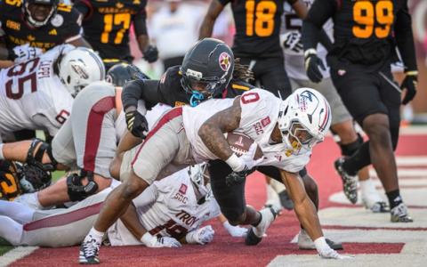 Troy running back Gavin Griffin (0) stretches toward the goal line as ULM defenders close in during ULM's 21-14 win at Troy's Veterans Memorial Stadium on Oct. 24, 2026.