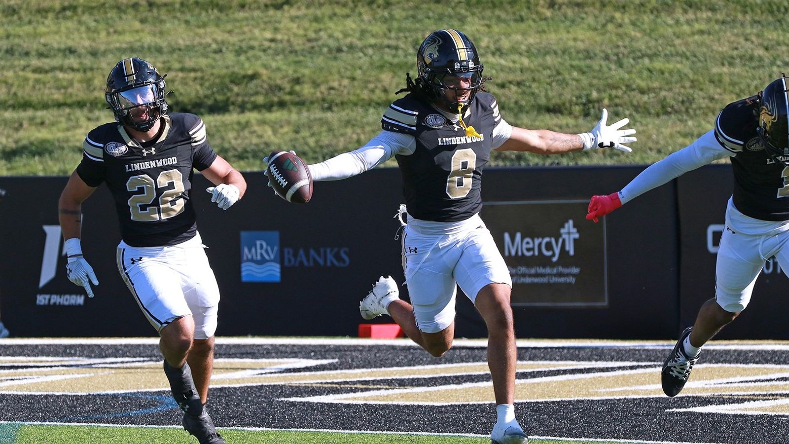 A Lindenwood player celebrates with the football alongside teammates during Lindenwood's 44-9 homecoming win over Chicago State on Oct. 24, 2026, in St. Charles, Missouri.