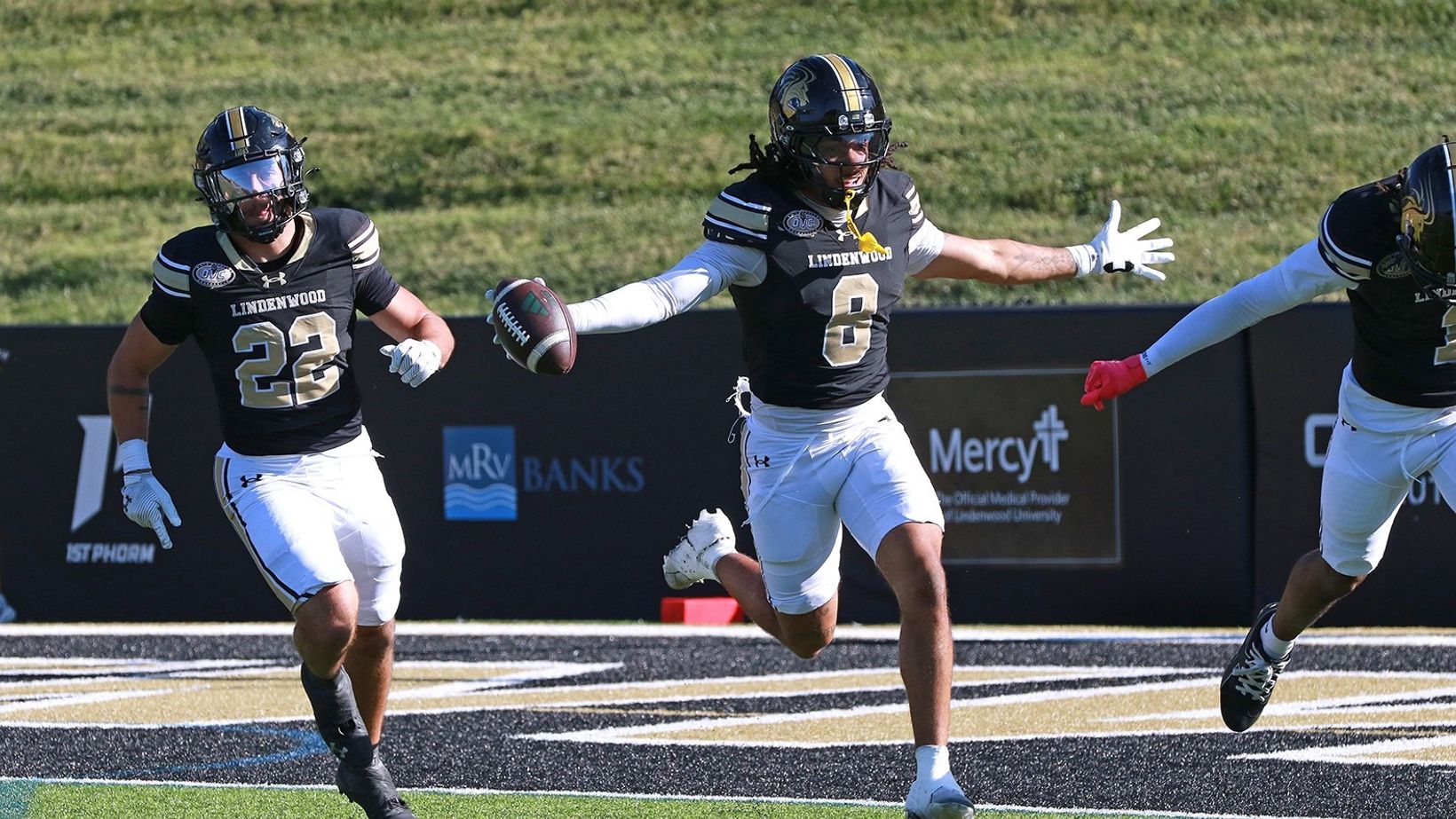 A Lindenwood player celebrates with the football alongside teammates during Lindenwood's 44-9 homecoming win over Chicago State on Oct. 24, 2026, in St. Charles, Missouri.