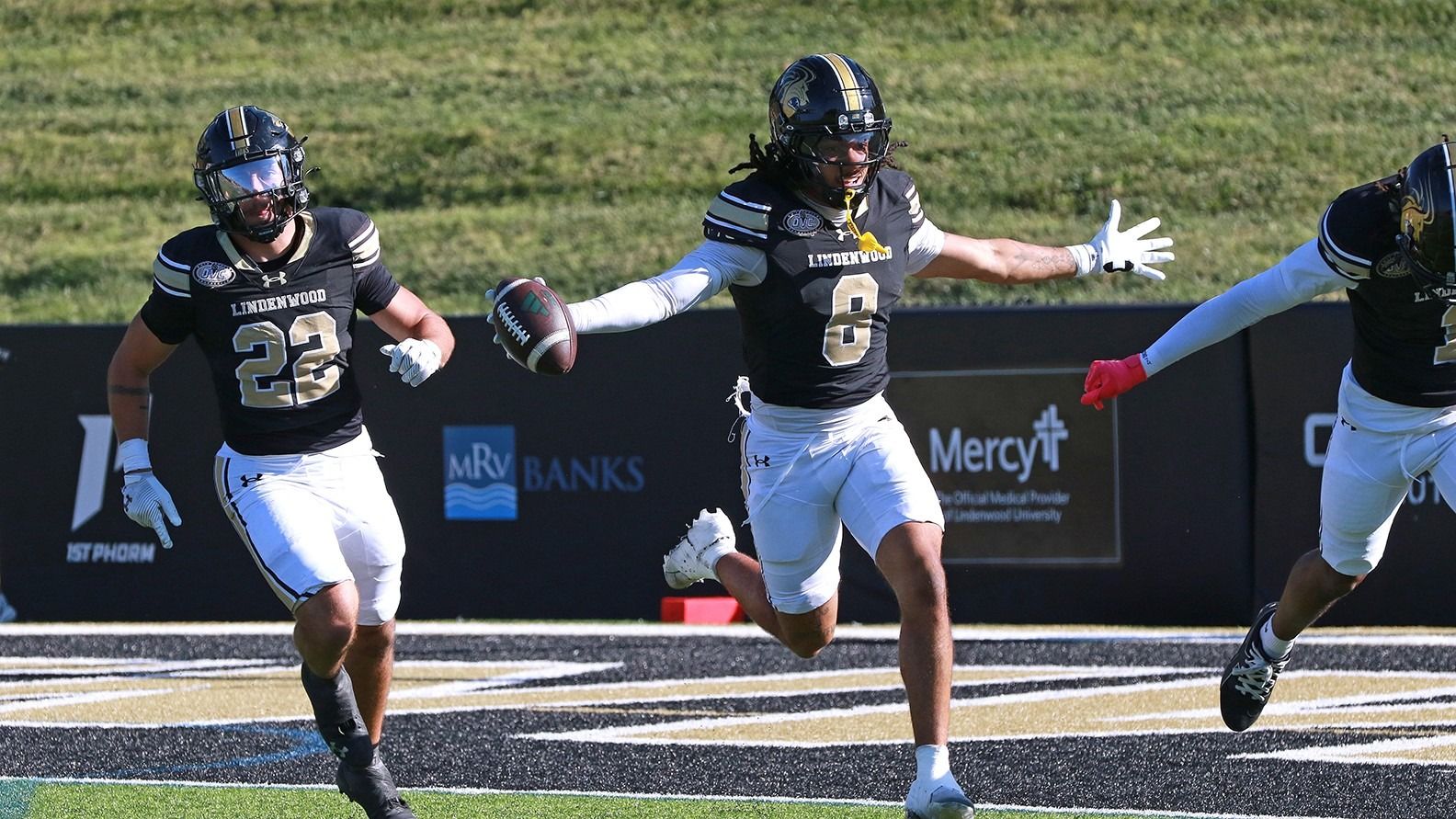 A Lindenwood player celebrates with the football alongside teammates during Lindenwood's 44-9 homecoming win over Chicago State on Oct. 24, 2026, in St. Charles, Missouri.