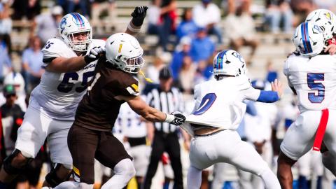 Valparaiso linebacker Max Samuel, in a brown No. 1 jersey, grabs the Presbyterian quarterback during Valpo's 24-7 win at Brown Field on Oct. 24, 2026