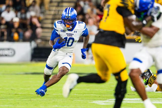 Georgia State football player carries the ball against Kennesaw State on Sept. 12, 2026.