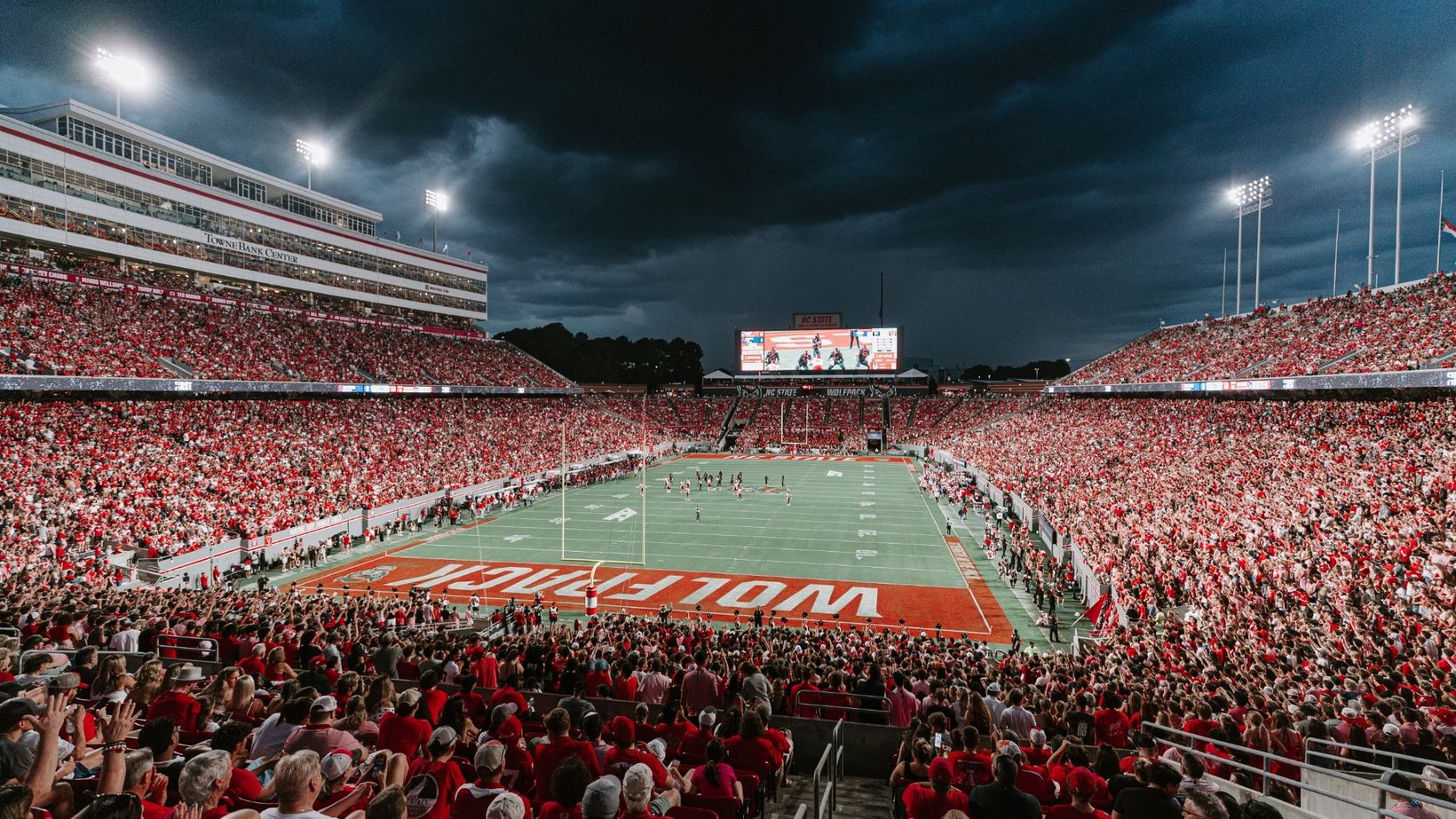 A packed Carter-Finley Stadium under the lights during an NC State football game in 2026, file photo