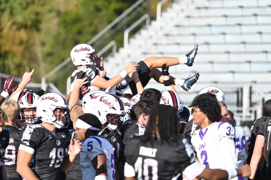 Weston Schofield is tossed into the air after kicking the game-winning field goal against Northern Iowa at Saluki Stadium