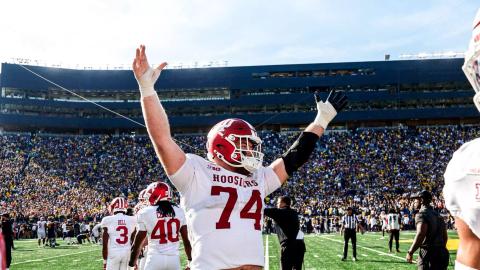 Indiana offensive lineman Bray Lynch (74) raises his arms in celebration in front of the Michigan Stadium crowd after the Hoosiers' 13-6 overtime win over Michigan in Ann Arbor on October 24, 2026.