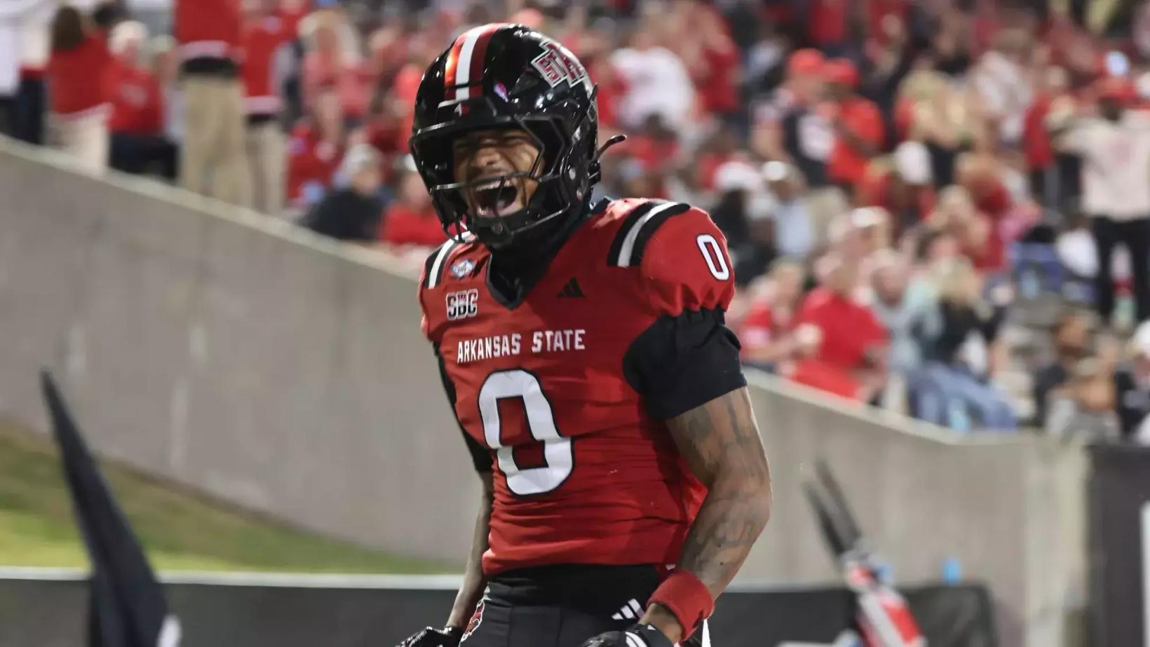 Arkansas State receiver Nana Burris (0) shouts in celebration near the end zone in front of a homecoming crowd during the Red Wolves' 38-32 win over Georgia State on Oct. 24, 2026