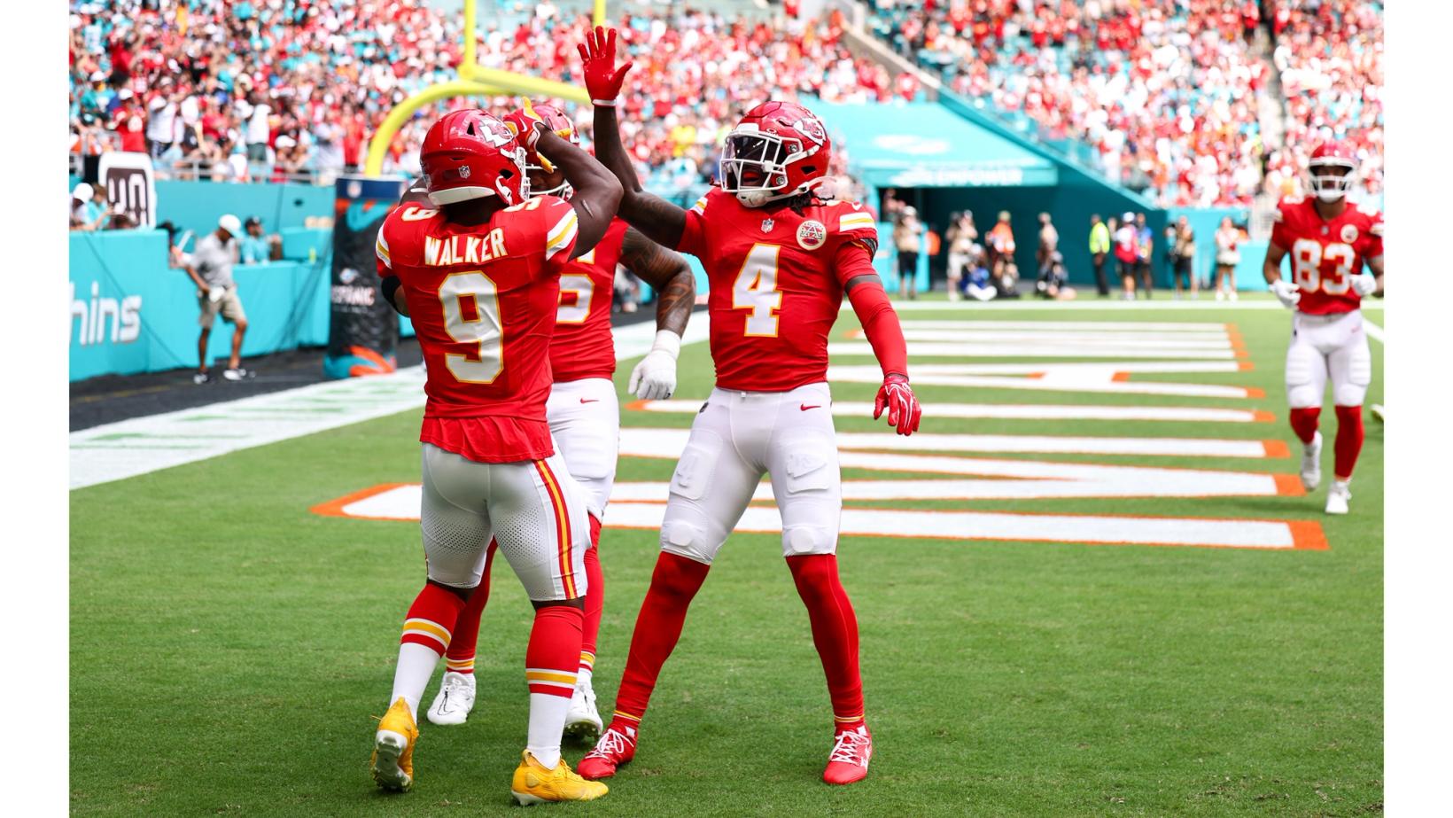 Kansas City Chiefs running back Kenneth Walker III (9) and wide receiver Rashee Rice (4) celebrate in the end zone at Hard Rock Stadium