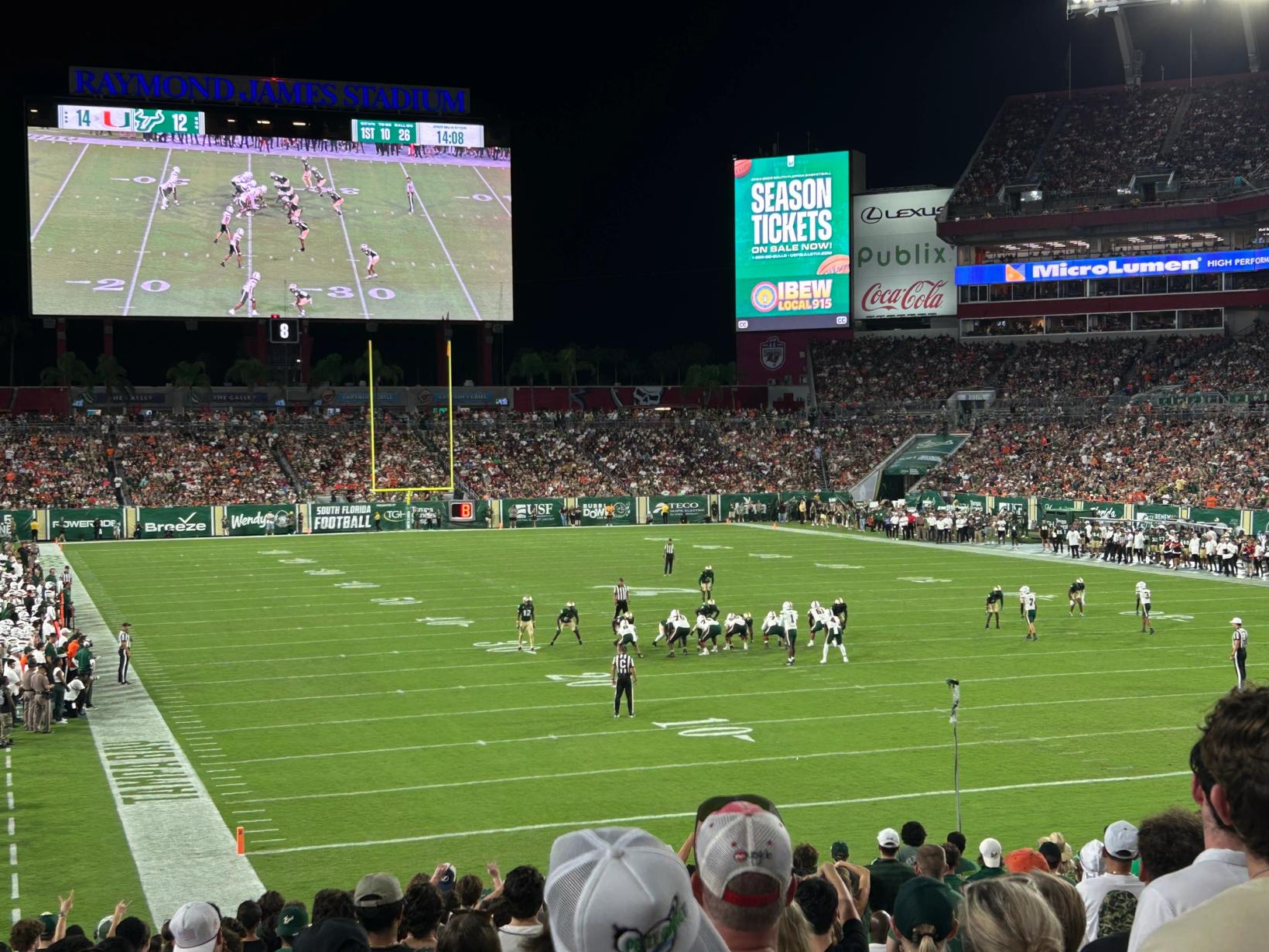 File photo: South Florida and Miami players line up at the line of scrimmage under the lights at Raymond James Stadium in Tampa on Sept. 21, 2024, seen from the USF student section. USF beat UAB 30-10 in the same stadium on Oct. 31, 2026.