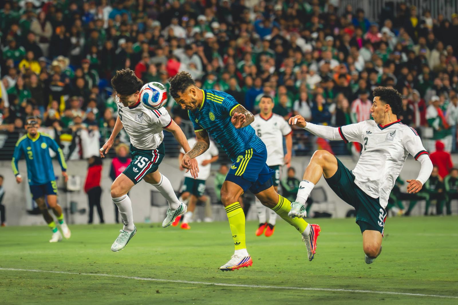 Mexico and Colombia players battle for the ball in mid-air — Photo Credit: Arturo Rosales Sevilla/Undrafted