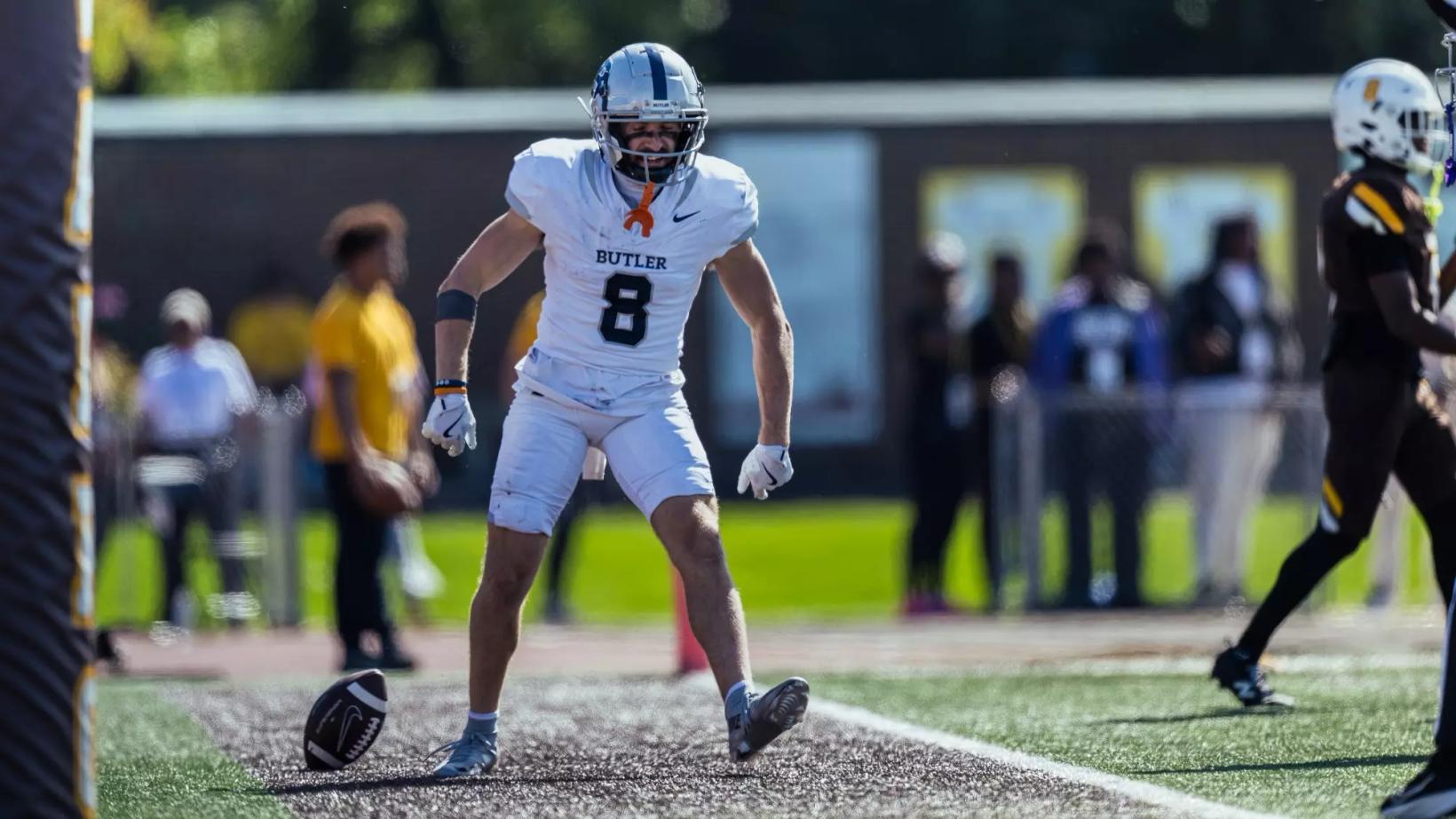 Butler wide receiver Nick Munson, No. 8 in a white road uniform, reacts near the end zone during a game against Valparaiso (file photo).