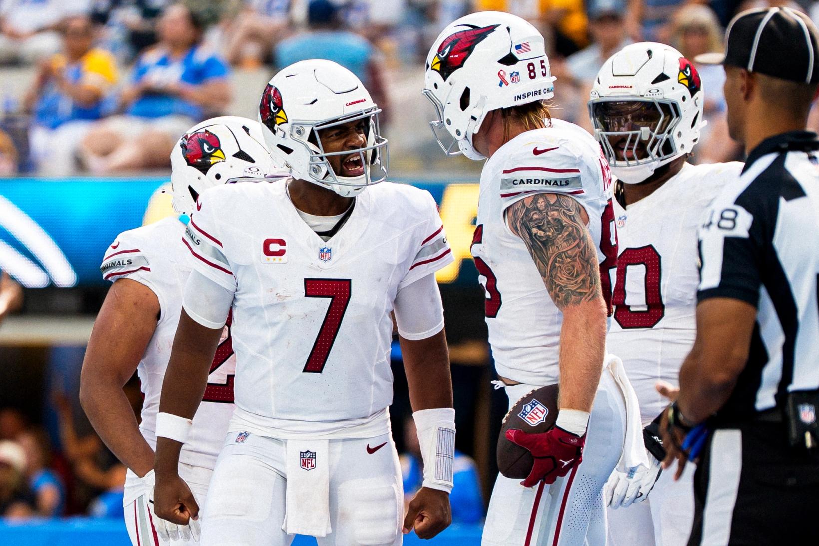 Arizona Cardinals quarterback Jacoby Brissett (7) celebrates with tight end Trey McBride (85), who holds the ball, and teammates at SoFi Stadium