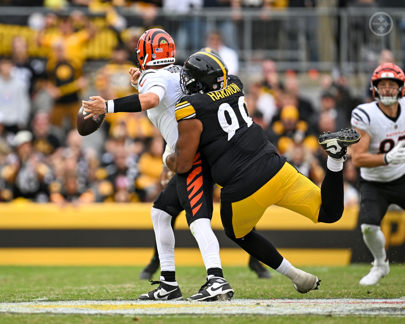 Pittsburgh Steelers defensive tackle Derrick Harmon (99) hits Cincinnati Bengals quarterback Joe Burrow (9) as the ball comes out of Burrow's hand at Acrisure Stadium