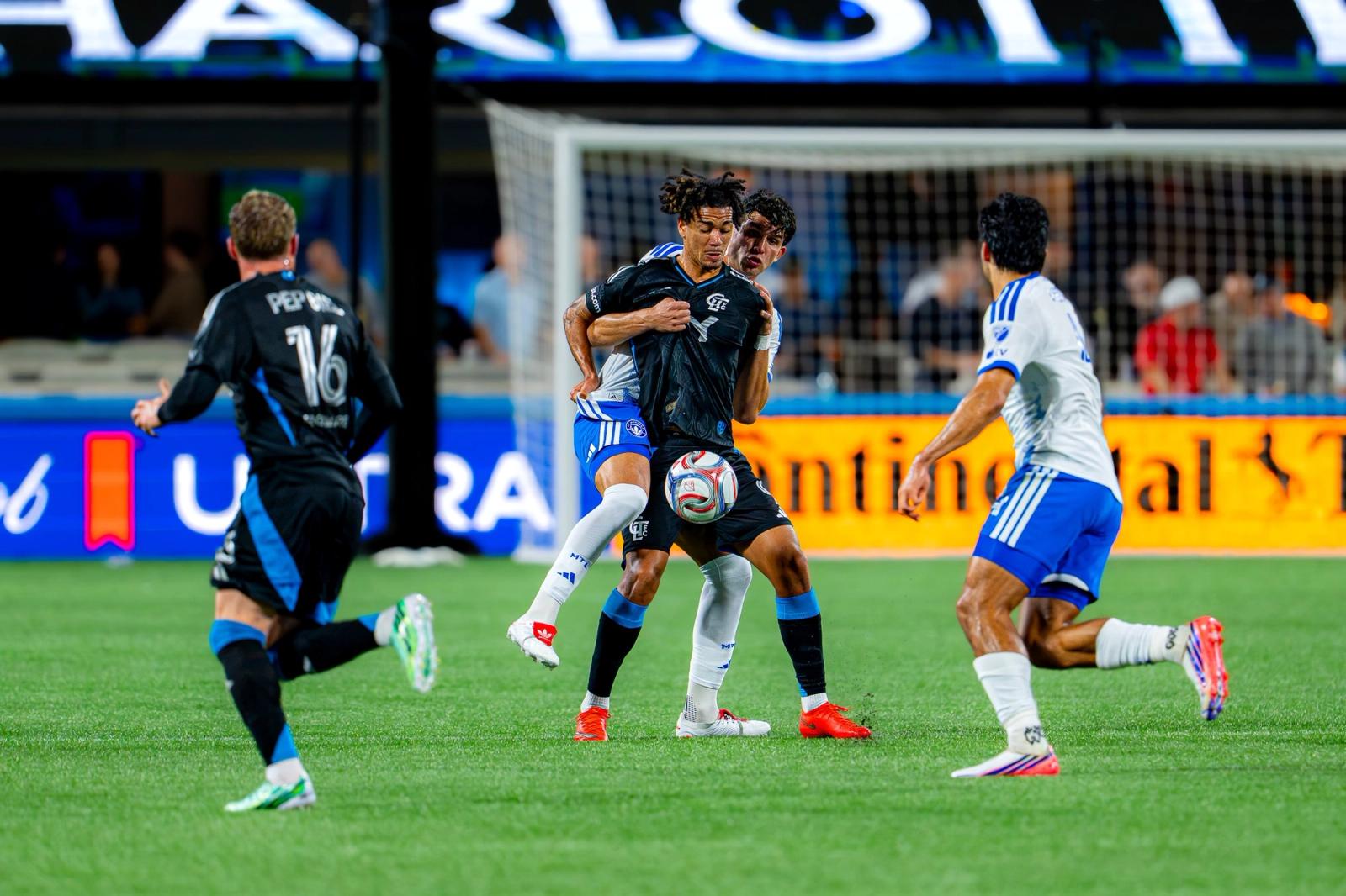 Charlotte FC and CF Montréal players battle for the ball in front of goal at Bank of America Stadium — Photo Credit: Arturo Rosales Sevilla/Undrafted