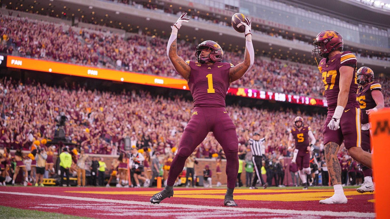 Minnesota running back Darius Taylor, No. 1, raises the football over his head in the end zone after his touchdown against Iowa at Huntington Bank Stadium on October 24, 2026.
