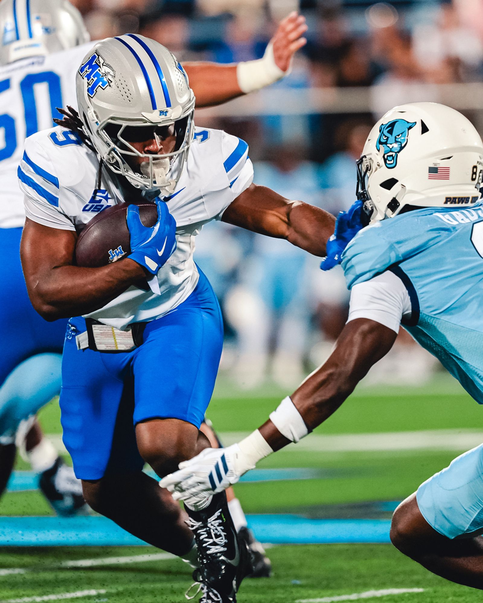 Middle Tennessee running back Terrence Brown Jr. (9) carries the ball as an FIU defender closes in during MTSU's 26-23 win at FIU on Oct. 20, 2026