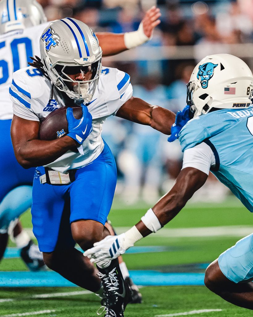 Middle Tennessee running back Terrence Brown Jr. (9) carries the ball as an FIU defender closes in during MTSU's 26-23 win at FIU on Oct. 20, 2026