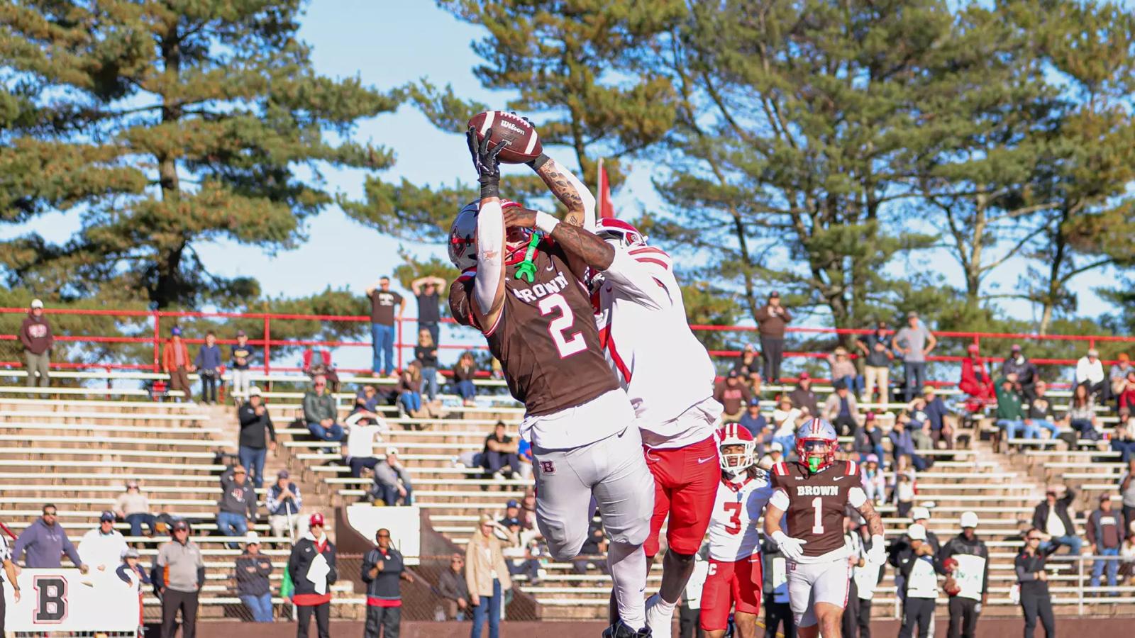 Brown's Matt Childs, No. 2, catches the game-tying touchdown over a Cornell defender in the end zone at Brown Stadium
