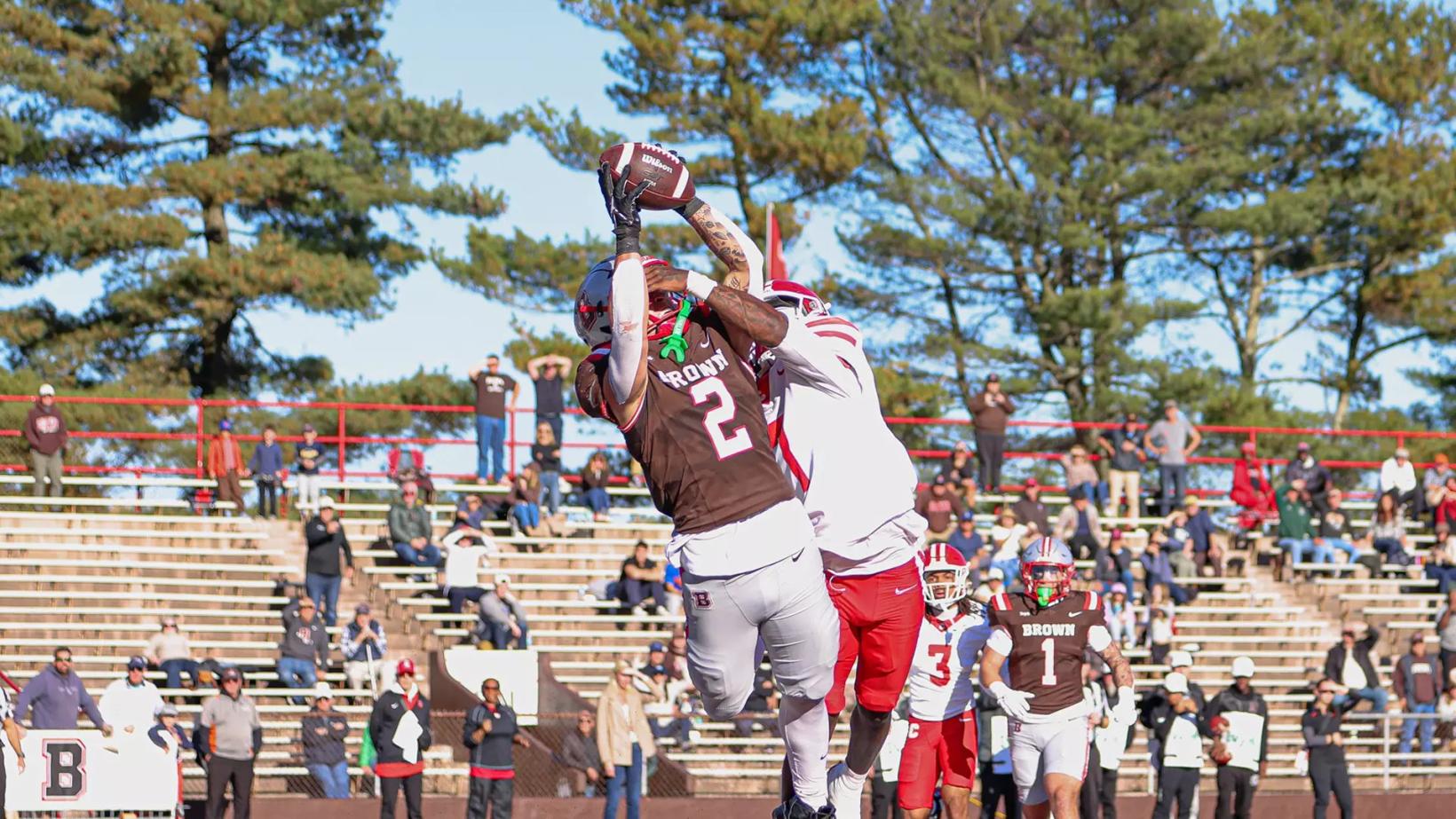 Brown's Matt Childs, No. 2, catches the game-tying touchdown over a Cornell defender in the end zone at Brown Stadium