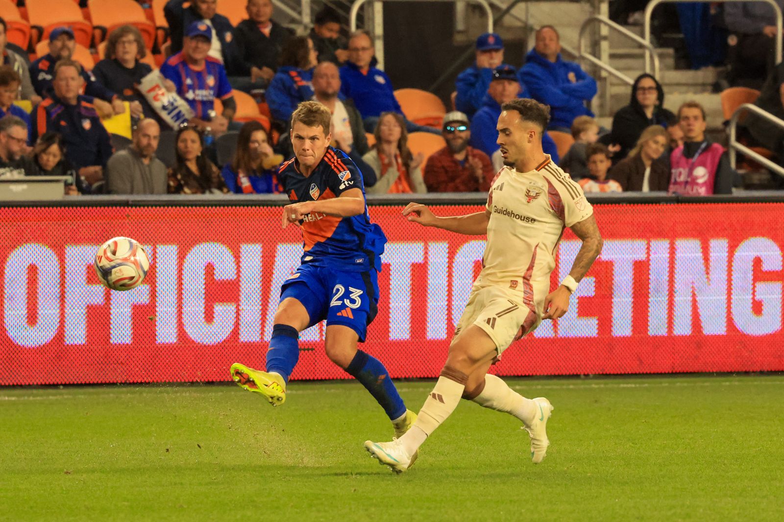 FC Cincinnati's David Douděra plays the ball under pressure from a D.C. United defender during the October 21, 2026 match at TQL Stadium.