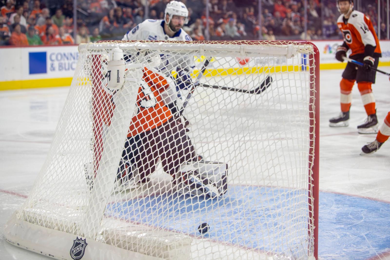 The puck crosses the goal line past the Flyers goaltender during the January 10, 2026 game at Xfinity Mobile Arena in Philadelphia.