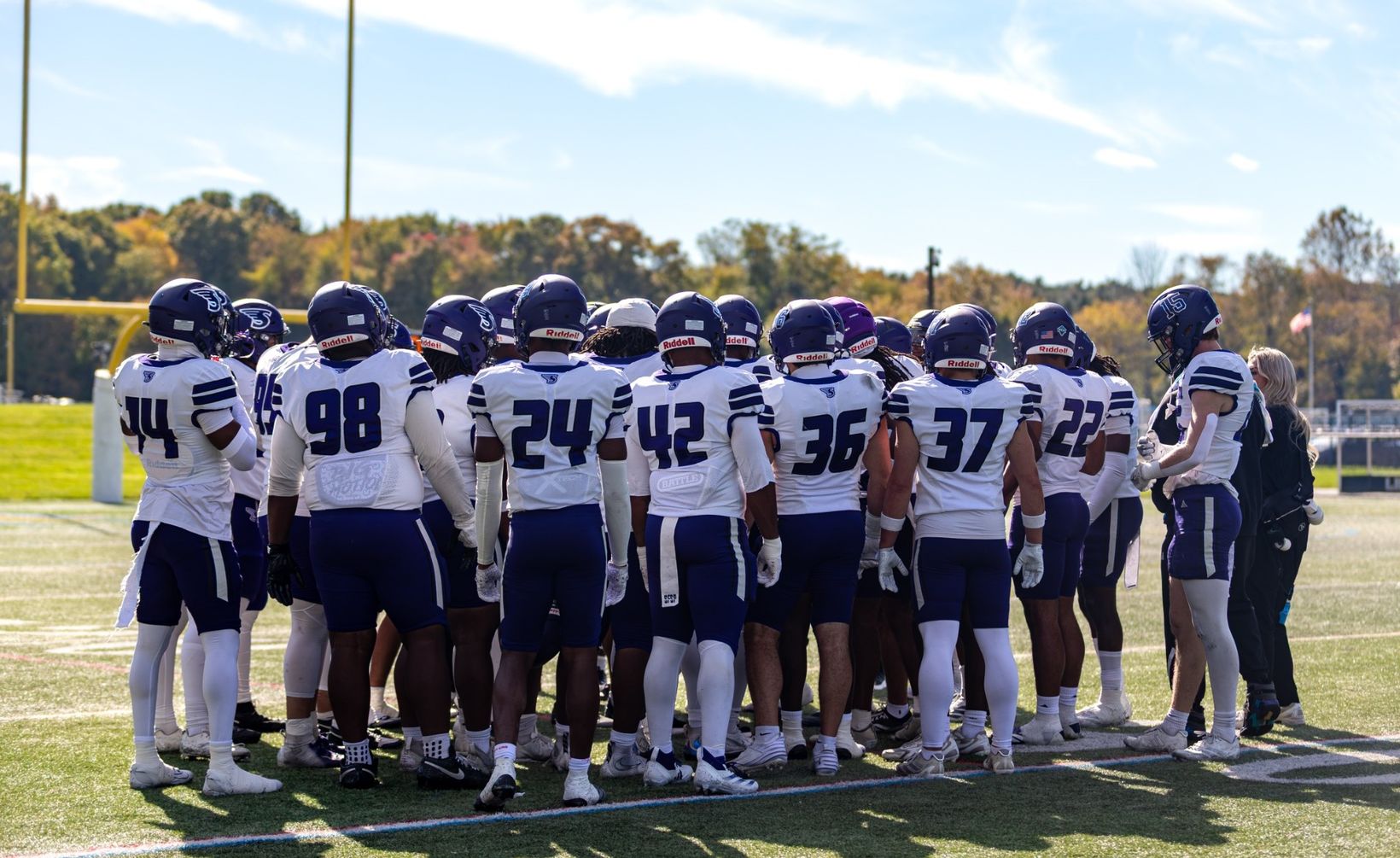 Stonehill football players gather in a team huddle during the 2026 season; used with the Skyhawks' 34-28 win over Mercyhurst on Oct. 31, 2026