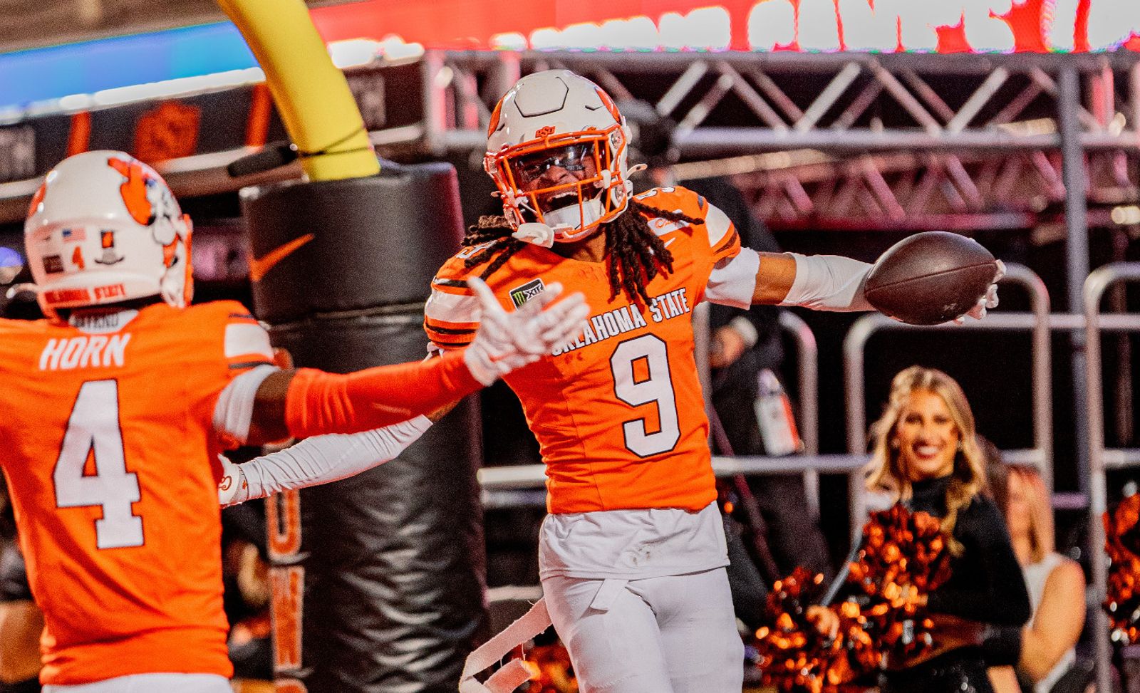 Oklahoma State cornerback LaDainian Fields (9) celebrates with the ball as a teammate reaches toward him during the Cowboys' 57-24 homecoming win over Colorado at Boone Pickens Stadium on Oct. 24, 2026