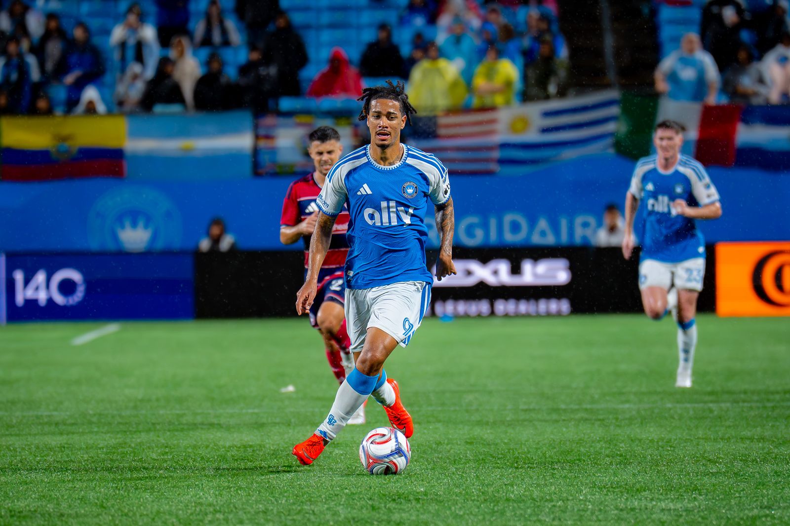 Charlotte FC player dribbles under the lights against FC Dallas. Photo Credit: Arturo Rosales Sevilla/Undrafted