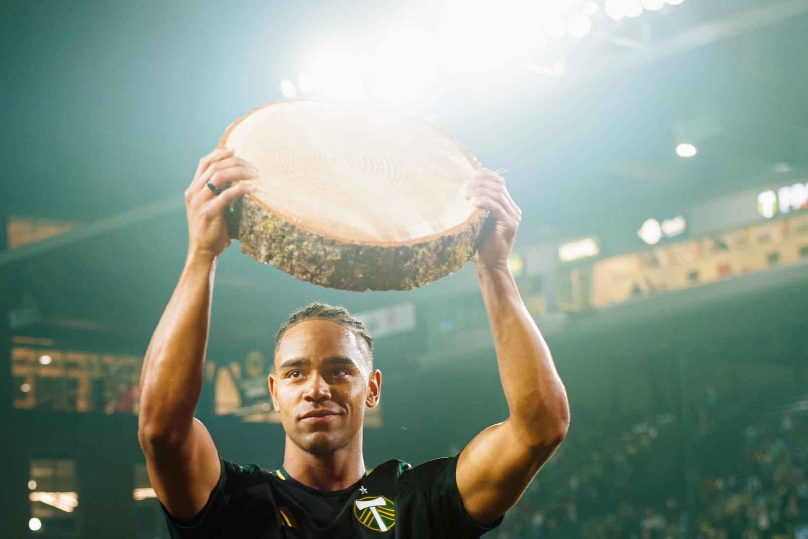 A Portland Timbers player holds up a slab of the victory log after the 2-1 win over Seattle Sounders FC during the August 1, 2026 MLS match at Providence Park.