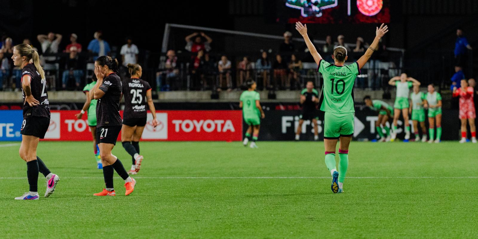 Boston Legacy player raises arms in victory as Portland Thorns players react after the match — Photo Credit: Aaron Leopold/Undrafted