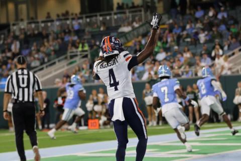 A UTSA player raises his arm in celebration as Tulane players run past during the Roadrunners' 42-19 win at Yulman Stadium on October 24, 2026.