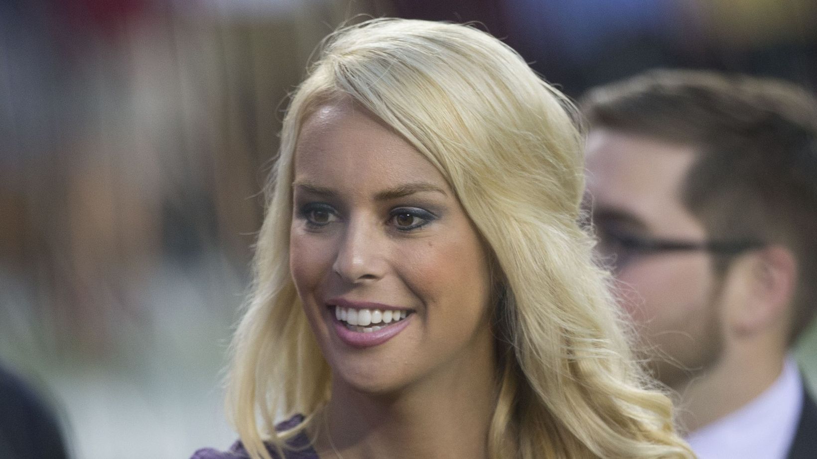 Britt McHenry smiles on the field before a Lions-Redskins preseason game in August 2015.
