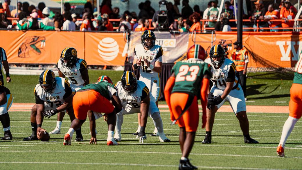 Arkansas-Pine Bluff quarterback (12) stands behind the center at the line of scrimmage as Florida A&M defenders wait at Bragg Memorial Stadium during UAPB's 31-28 win on Oct. 24, 2026