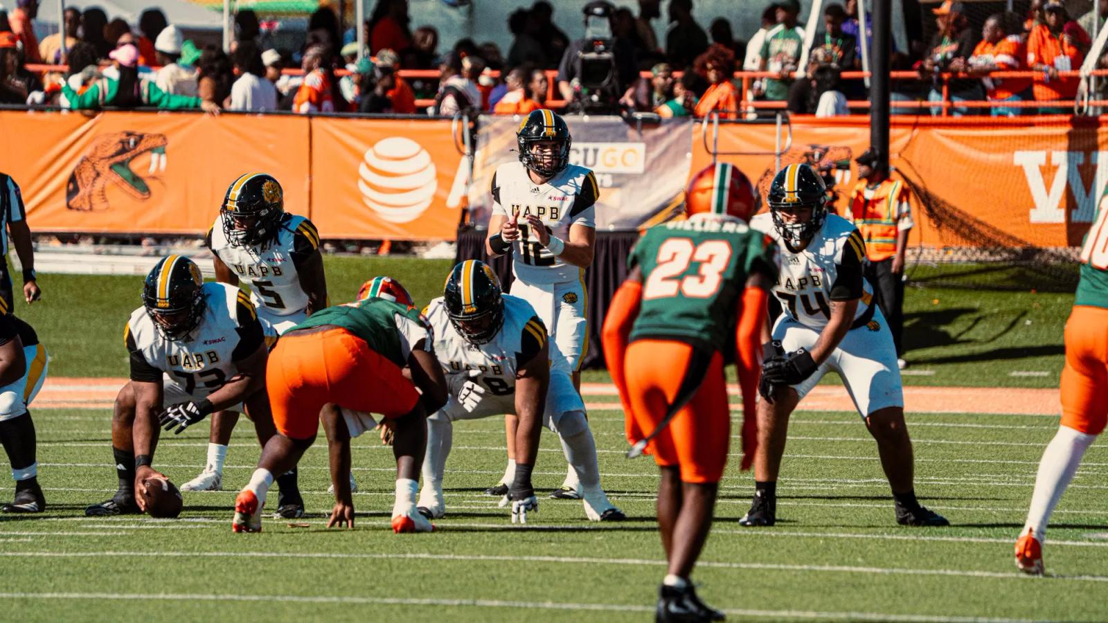Arkansas-Pine Bluff quarterback (12) stands behind the center at the line of scrimmage as Florida A&M defenders wait at Bragg Memorial Stadium during UAPB's 31-28 win on Oct. 24, 2026