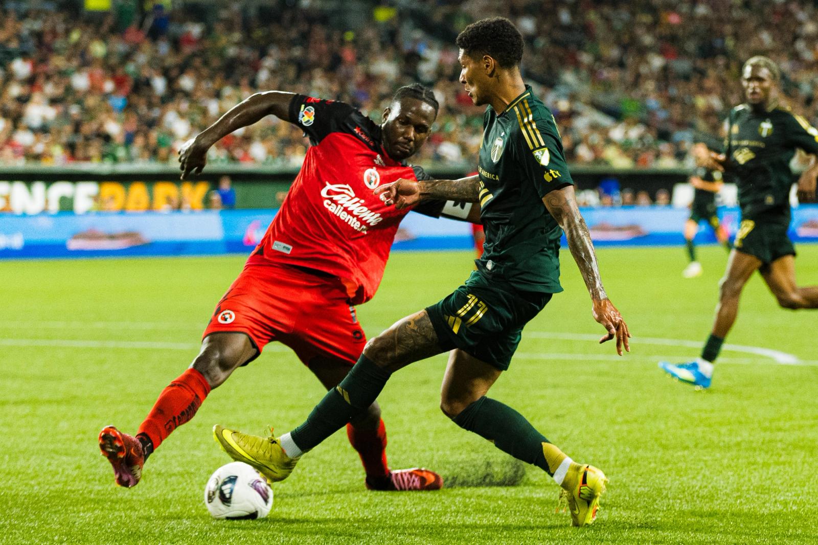 Portland Timbers winger Antony battles a Club Tijuana defender for the ball during the August 13, 2026 Leagues Cup match at Providence Park.