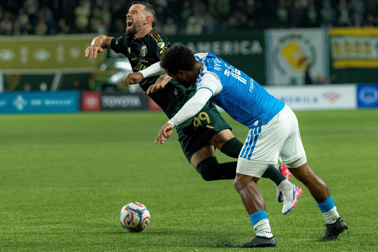 A Portland Timbers player and a Charlotte FC player battle for the ball during the October 24, 2026 match at Providence Park.