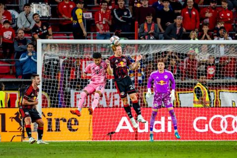 Players leap for a high ball in front of goal as the goalkeeper watches during Red Bull New York vs. Inter Miami at Sports Illustrated Stadium on October 24, 2026.