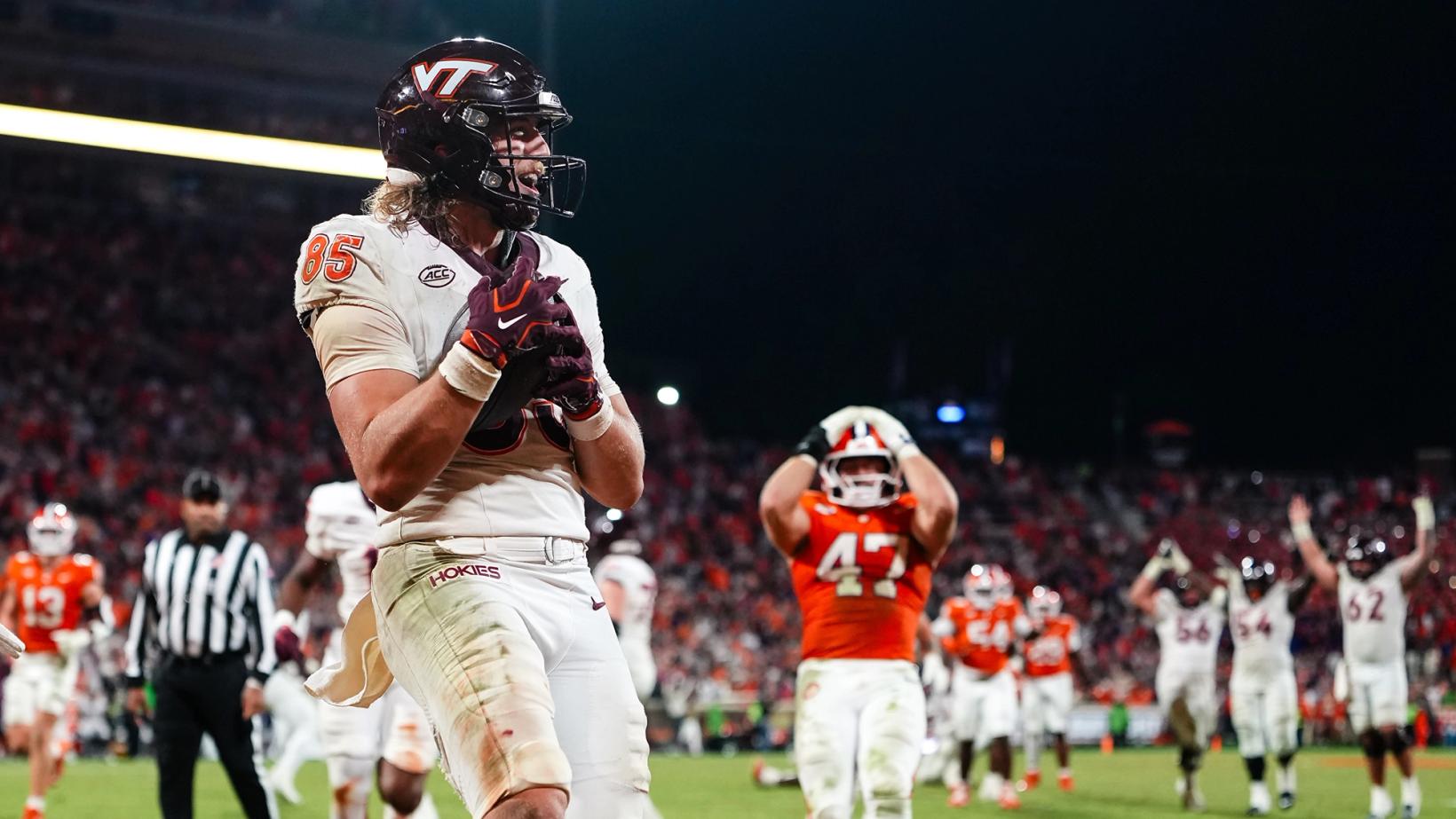 Virginia Tech tight end Luke Reynolds (85) holds the ball after a touchdown catch as a Clemson player stands with hands on helmet and Hokies linemen raise their arms in the background at Memorial Stadium on Oct. 24, 2026