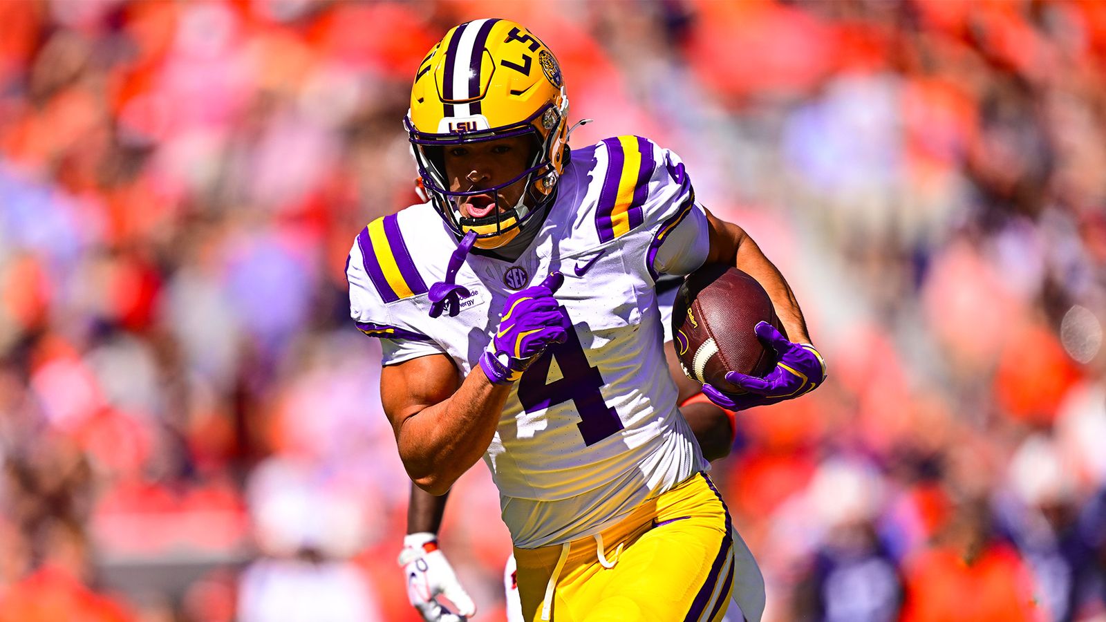 LSU No. 4, in a white jersey, runs with the ball during the Tigers' 38-17 win at Auburn on Oct. 24, 2026.