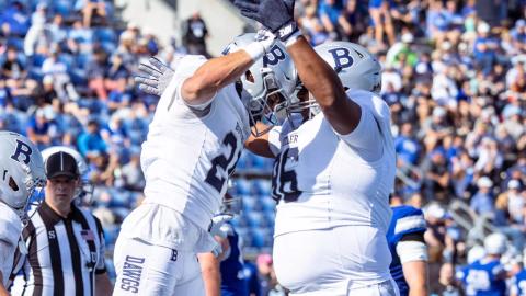 Butler players in white celebrate in the end zone during the Bulldogs' 33-21 win over Drake at Drake Stadium in Des Moines on October 24, 2026.