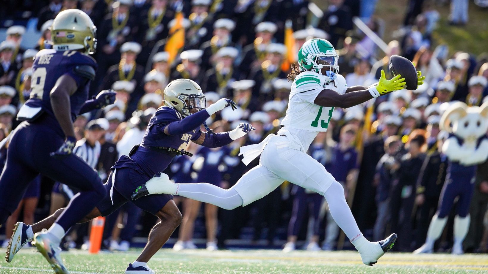 North Texas receiver Justin Stevenson, in white, stretches out for a catch ahead of a Navy defender at Navy-Marine Corps Memorial Stadium on October 24, 2026.